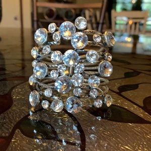 Very fancy bracelet with rhinestones of different sizes.